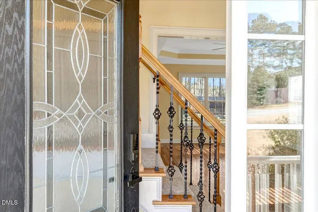 a view of an entryway with wooden floor