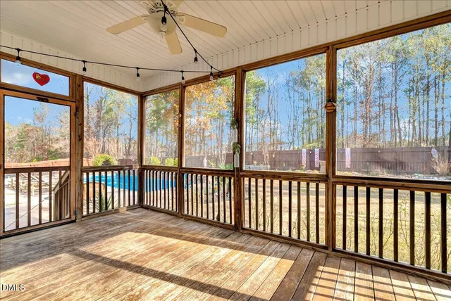 a view of a porch with wooden floor