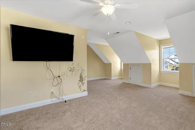 a view of an empty room with a flat screen tv