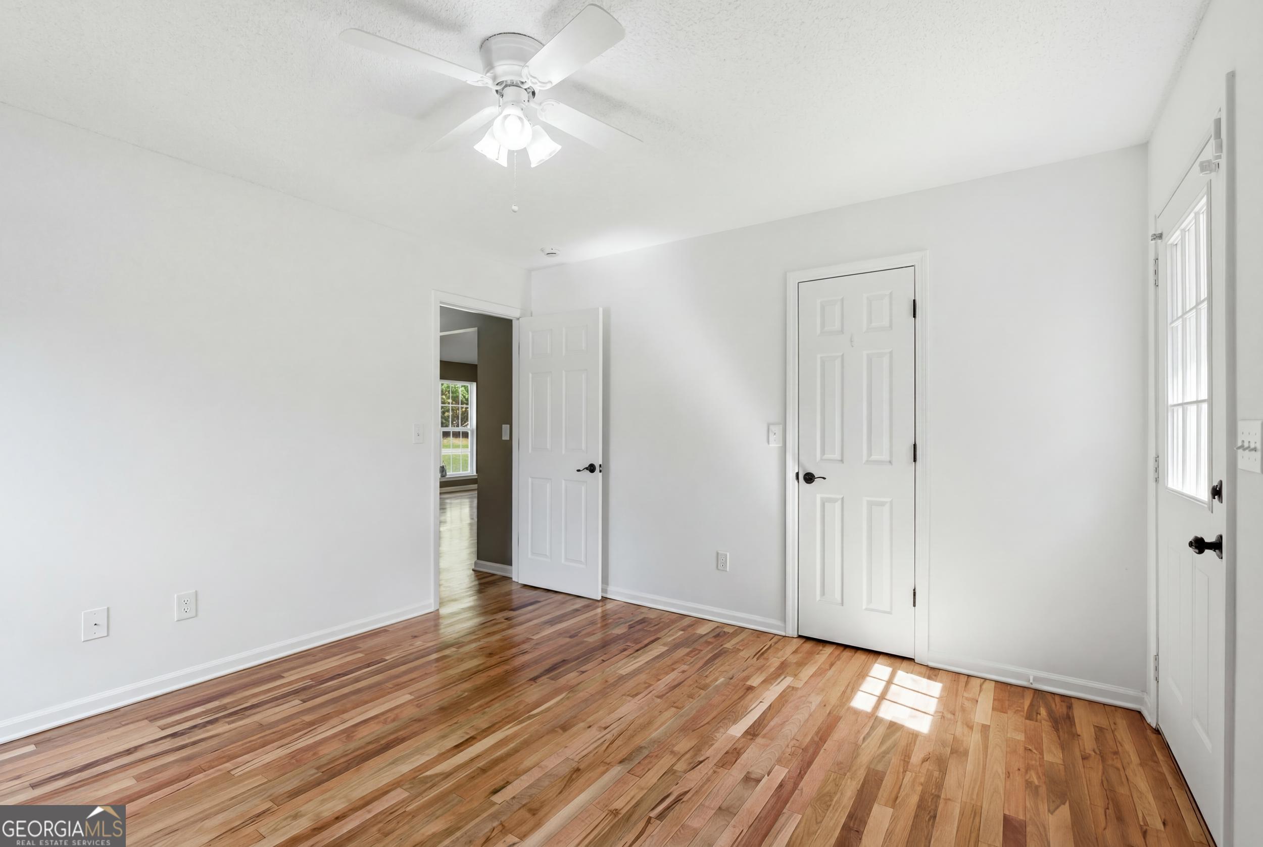 171 Winding Way Hartwell, GA 30643 - Photo 26 of 37 a view of an empty room with wooden floor