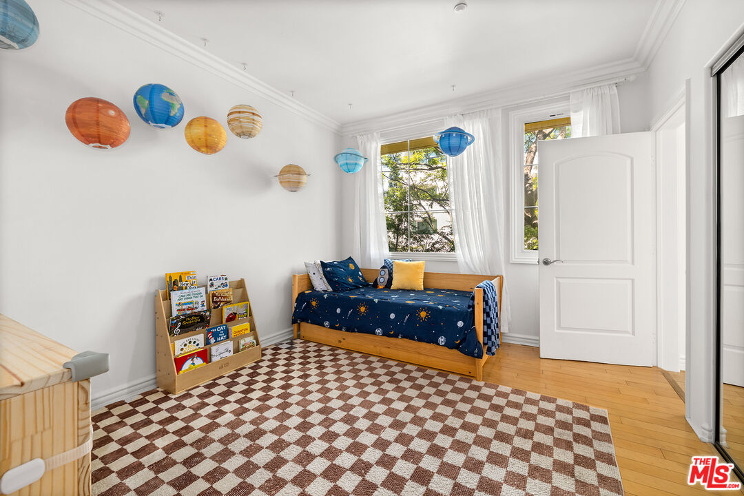 1601 South Bentley Avenue, Unit 201 Los Angeles, CA 90025 - Photo 21 of 39 a bedroom with a bed and a window