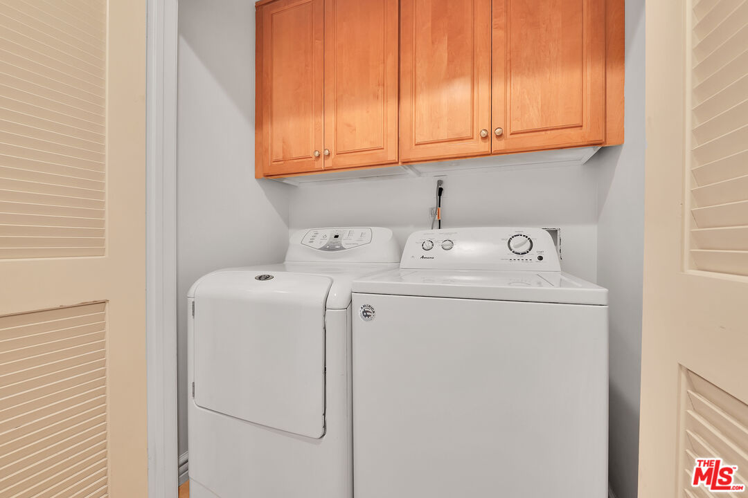 1601 South Bentley Avenue, Unit 201 Los Angeles, CA 90025 - Photo 30 of 39 a utility room with dryer and washer