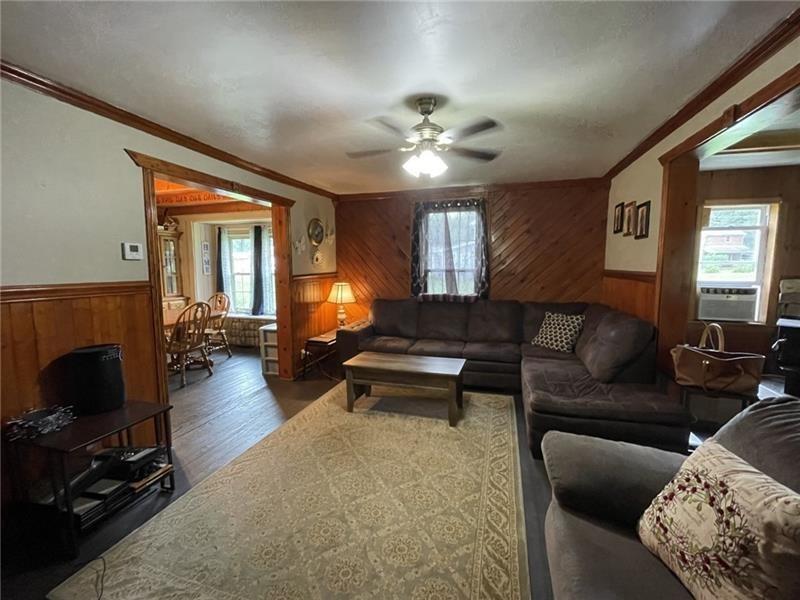 11 Stull Road Greenville, PA 16125 - Photo 1 of 26 a living room with furniture a fireplace and a chandelier