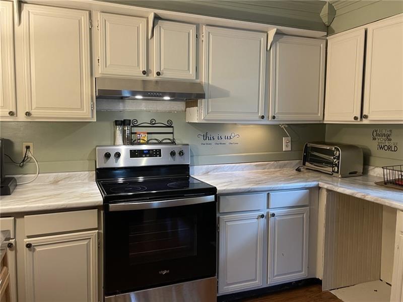 11 Stull Road Greenville, PA 16125 - Photo 5 of 26 a kitchen with stainless steel appliances granite countertop a sink a stove and cabinets