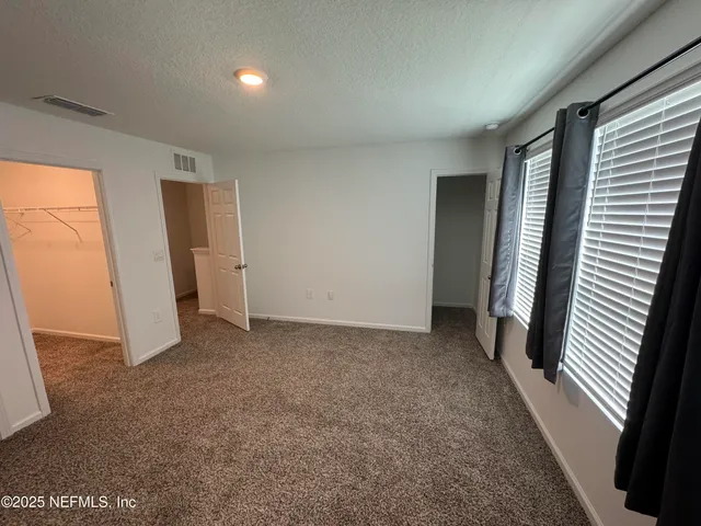 a view of storage and utility room with stairs