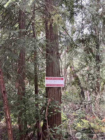a sign on the side of a tree