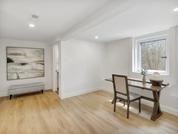 a view of a work space with furniture and window