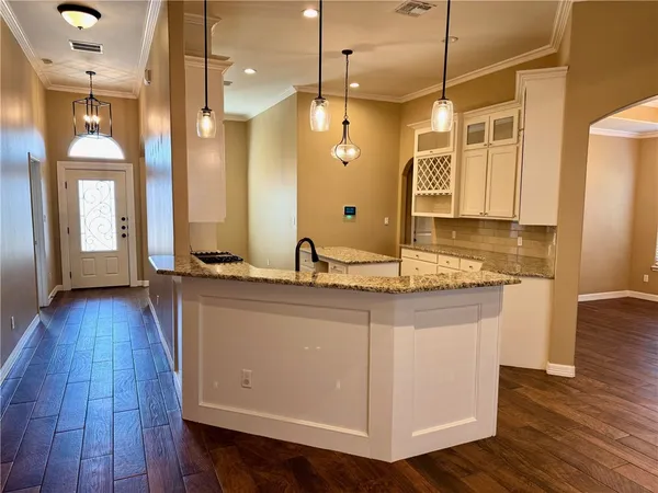 a bathroom with a sink a mirror and shower