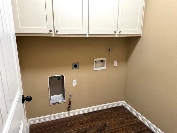 a close view of a sink and cabinets