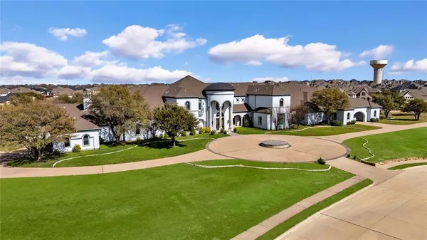 a view of a big yard in front of a house
