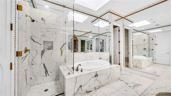 a bedroom with a bed and a large window with outer view