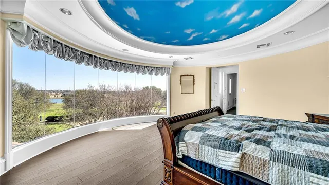 a bathroom with a sink vanity granite tub and a mirror