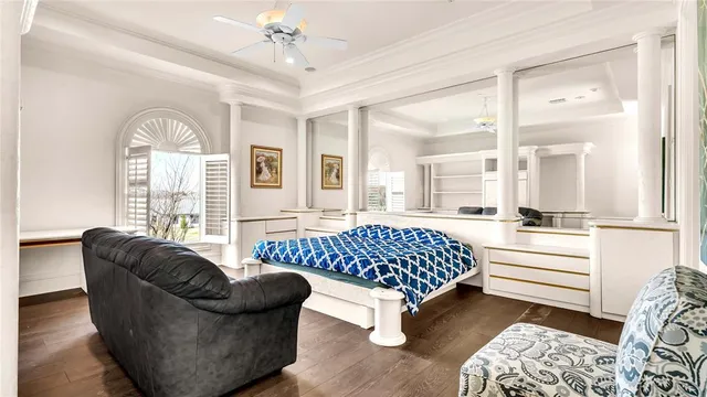 a bathroom with a double vanity sink a toilet and a tub