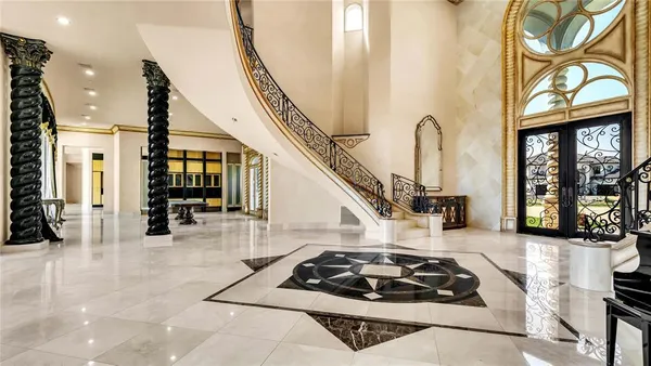 a kitchen with furniture and a fireplace