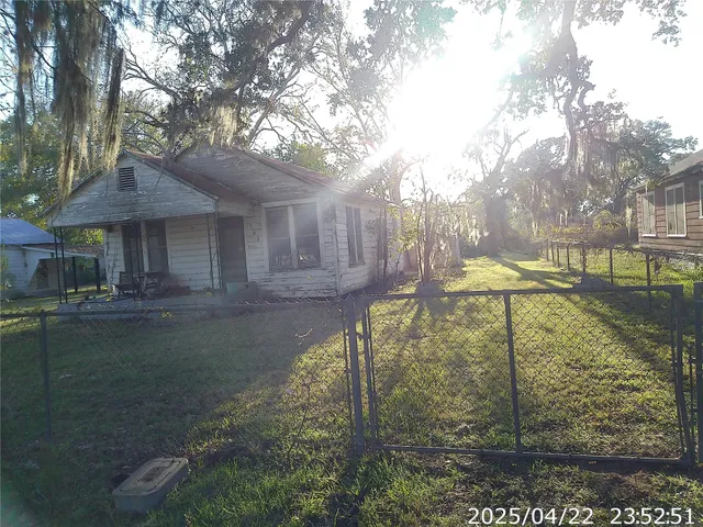 a view of a fountain in the backyard of house