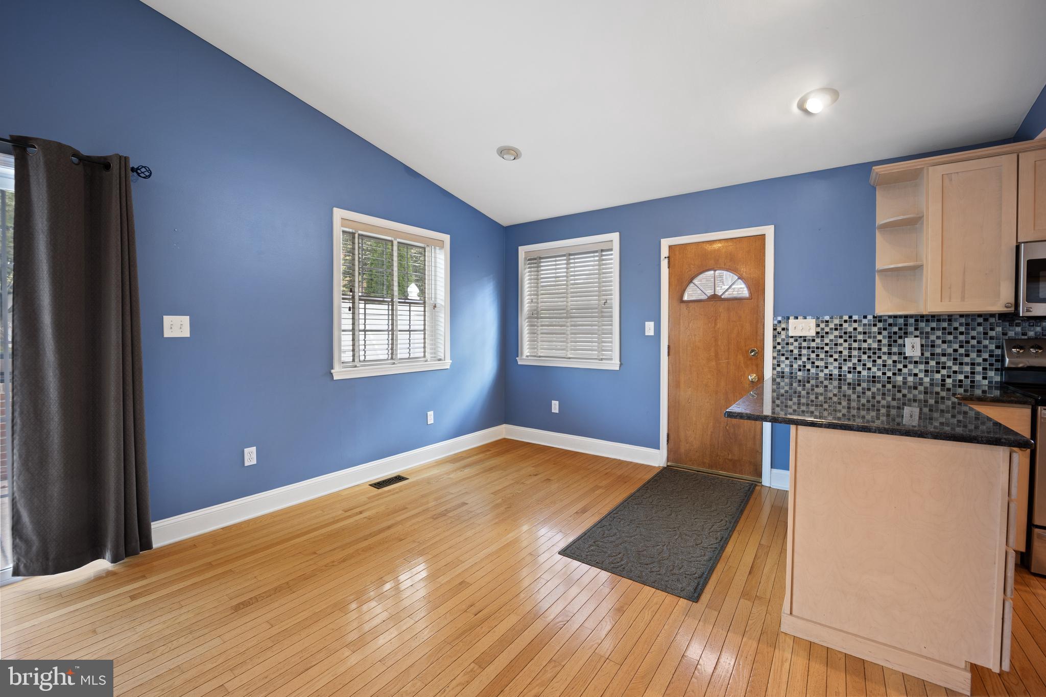268 Beechwood Avenue Springfield, PA 19064 - Photo 12 of 36 a view of an empty room with window and wooden floor