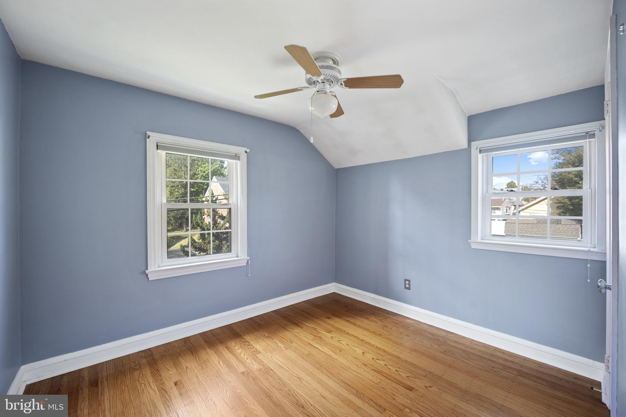 268 Beechwood Avenue Springfield, PA 19064 - Photo 20 of 36 a view of an empty room with wooden floor and a window