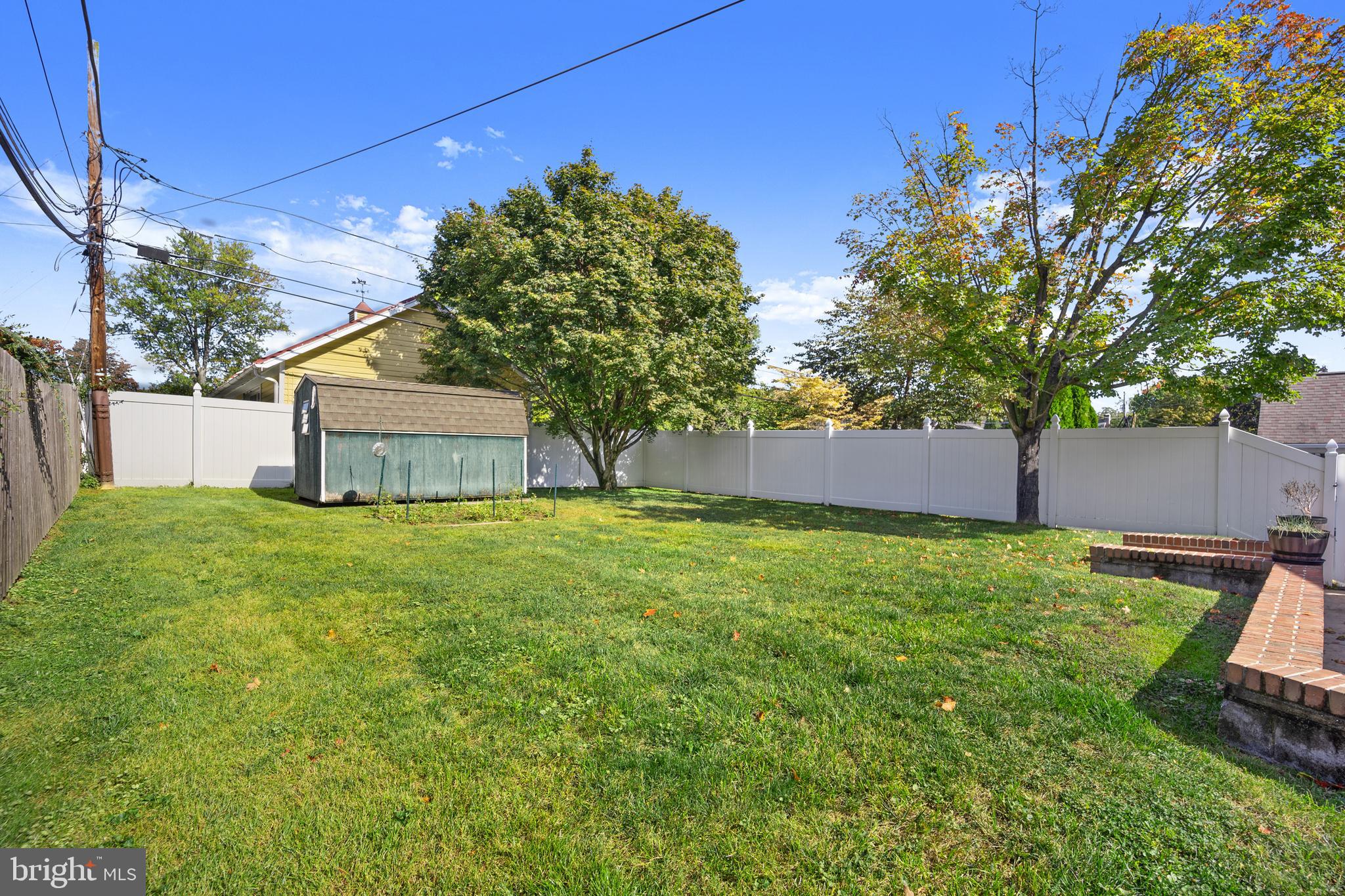 268 Beechwood Avenue Springfield, PA 19064 - Photo 31 of 36 a backyard of a house with lots of green space