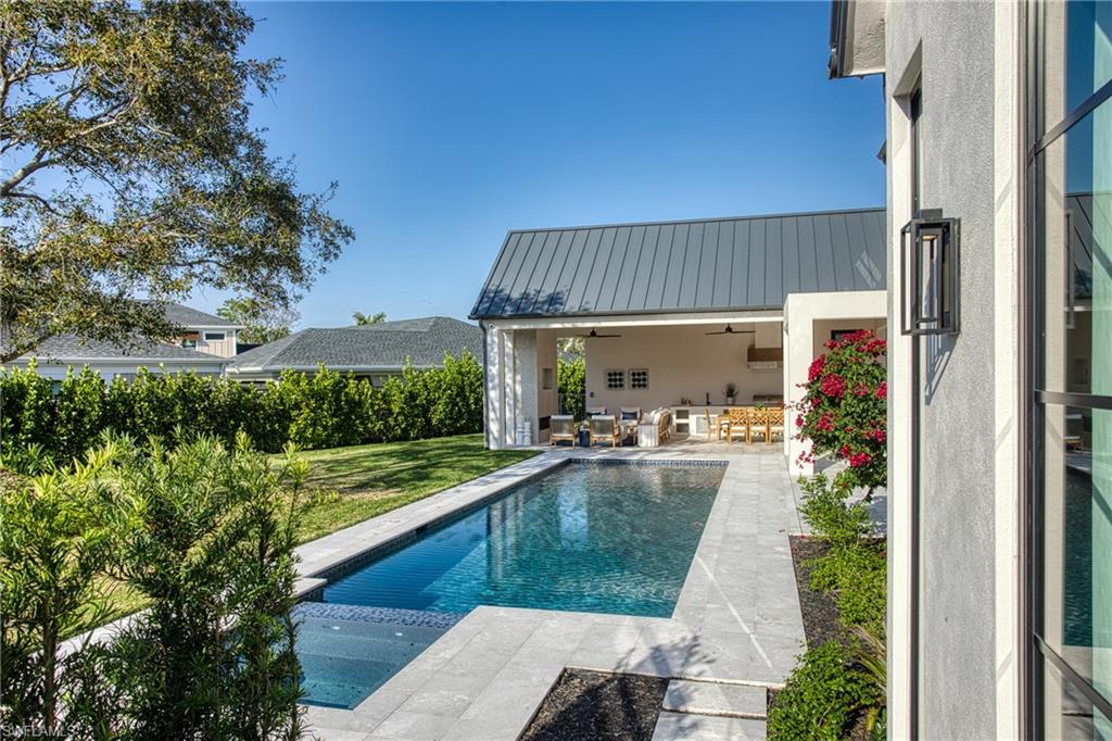 721 Springline Drive Naples, FL 34102 - Photo 38 of 50 a view of swimming pool having outdoor seating