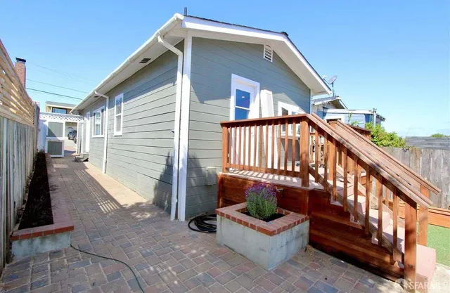 a view of a house with wooden floor and stairs