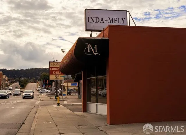 a view of a building with sitting area