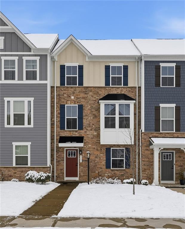 a front view of a house with yard
