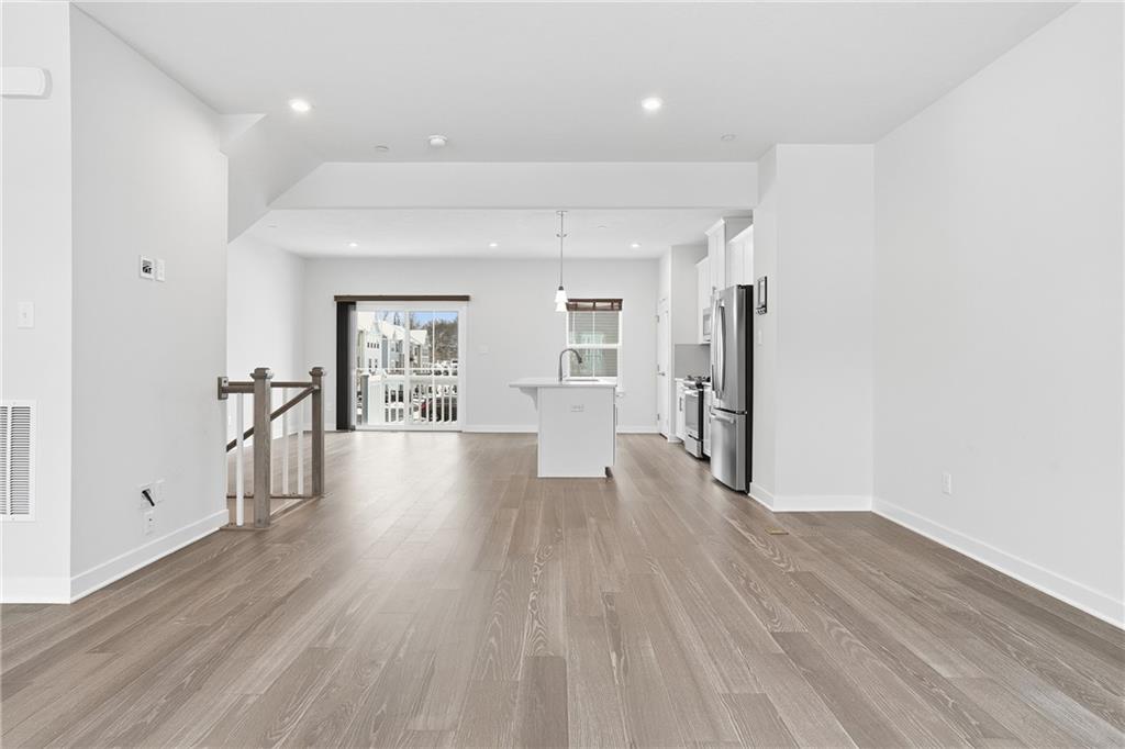 9002 Hickory Road Gibsonia, PA 15044 - Photo 16 of 46 a view of a big room with wooden floor and windows