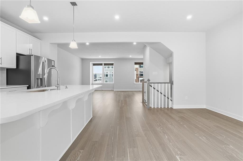 9002 Hickory Road Gibsonia, PA 15044 - Photo 10 of 46 a kitchen with stainless steel appliances a large counter top a sink a refrigerator and a window