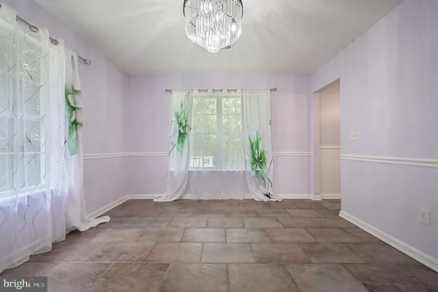 a view of room with window and hardwood floor