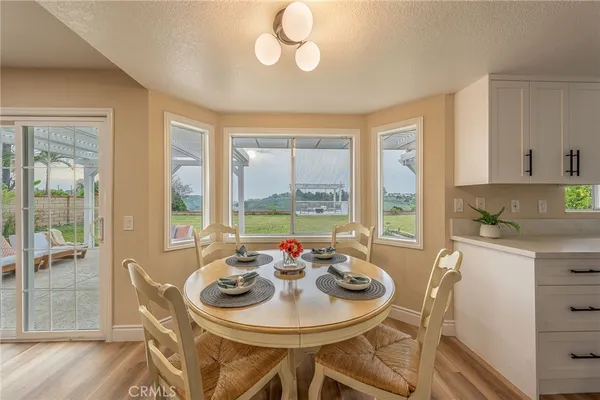 a view of a dining room with furniture window and outside view