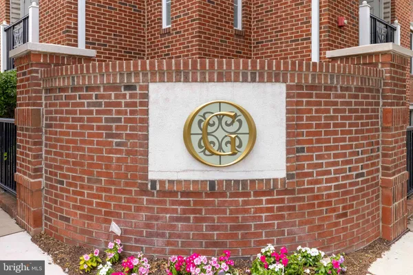 a brick building with a sign on it