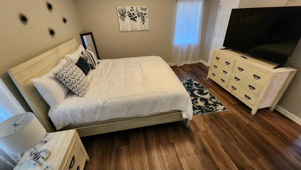 20 Fair Forest Terrace Covington, GA 30016 - Photo 12 of 19 a bedroom with a bed and flat screen tv