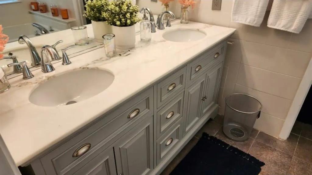 20 Fair Forest Terrace Covington, GA 30016 - Photo 15 of 19 a bathroom with a sink and a mirror