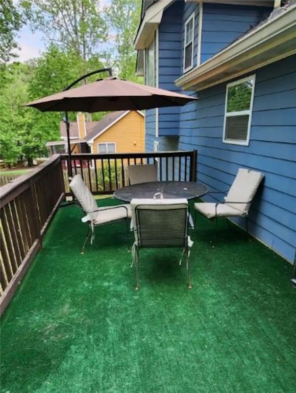 20 Fair Forest Terrace Covington, GA 30016 - Photo 17 of 19 a view of a chair and table in the deck
