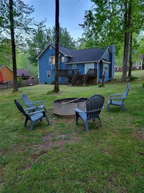20 Fair Forest Terrace Covington, GA 30016 - Photo 18 of 19 a view of a house with a yard table and chair