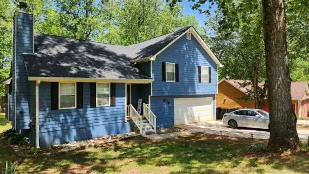 20 Fair Forest Terrace Covington, GA 30016 - Photo 2 of 19 a front view of a house with a yard