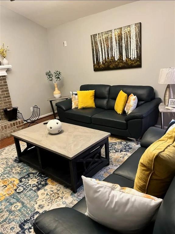 20 Fair Forest Terrace Covington, GA 30016 - Photo 3 of 19 a living room with furniture and wooden floor