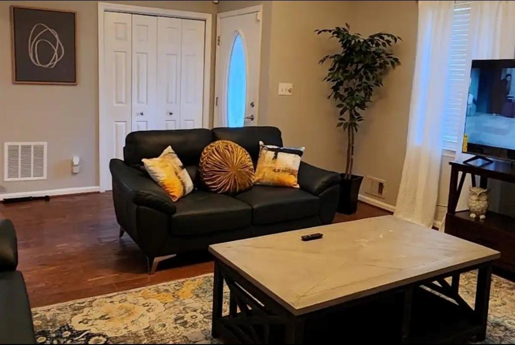 20 Fair Forest Terrace Covington, GA 30016 - Photo 4 of 19 a living room with furniture and wooden floor
