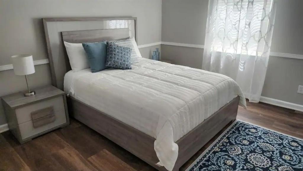 20 Fair Forest Terrace Covington, GA 30016 - Photo 9 of 19 a large bed sitting in a bedroom next to a window