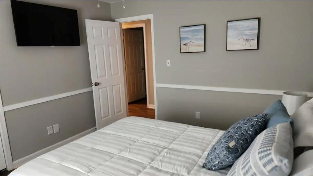 20 Fair Forest Terrace Covington, GA 30016 - Photo 10 of 19 a bedroom with a bed and a flat screen tv