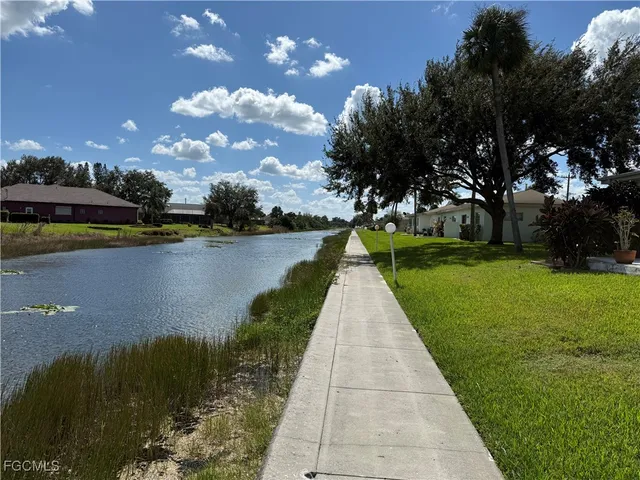 a view of a lake with a yard