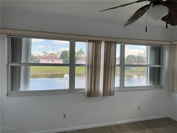 a view of a room that has a large window
