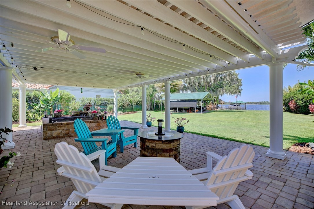 7411 Sparta Road Sebring, FL 33875 - Photo 31 of 50 a outdoor space with patio lots of furniture and garden