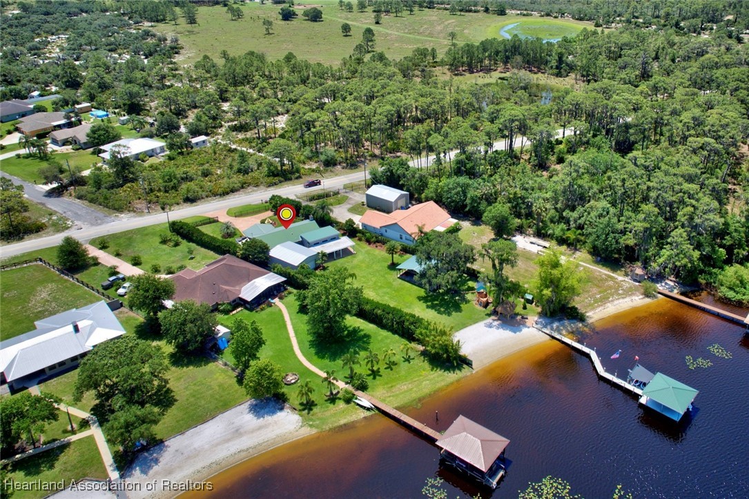 7411 Sparta Road Sebring, FL 33875 - Photo 46 of 50 an aerial view of a house with a yard