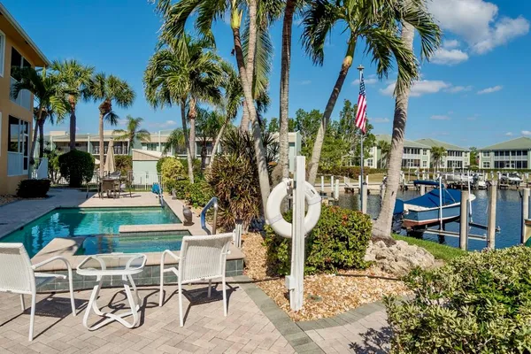 a view of a chairs and table in the patio