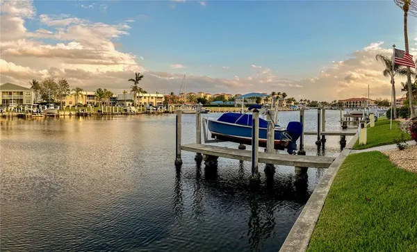 a view of a swimming pool with a patio and a garden