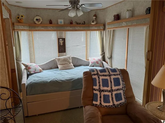 a bedroom with a bed and window