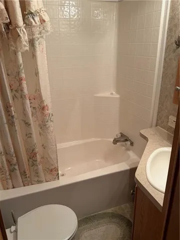 a bathroom with a sink toilet and bathtub