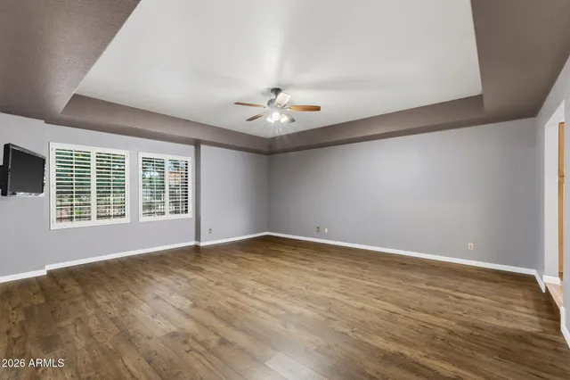 a large bathroom with a double vanity sink a mirror and a toilet