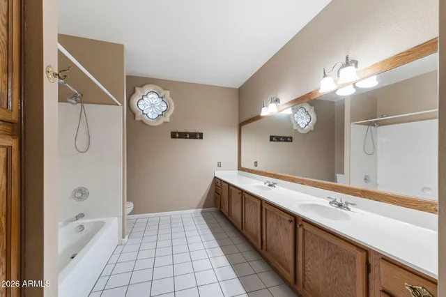 a living room with furniture a dining table and a fireplace